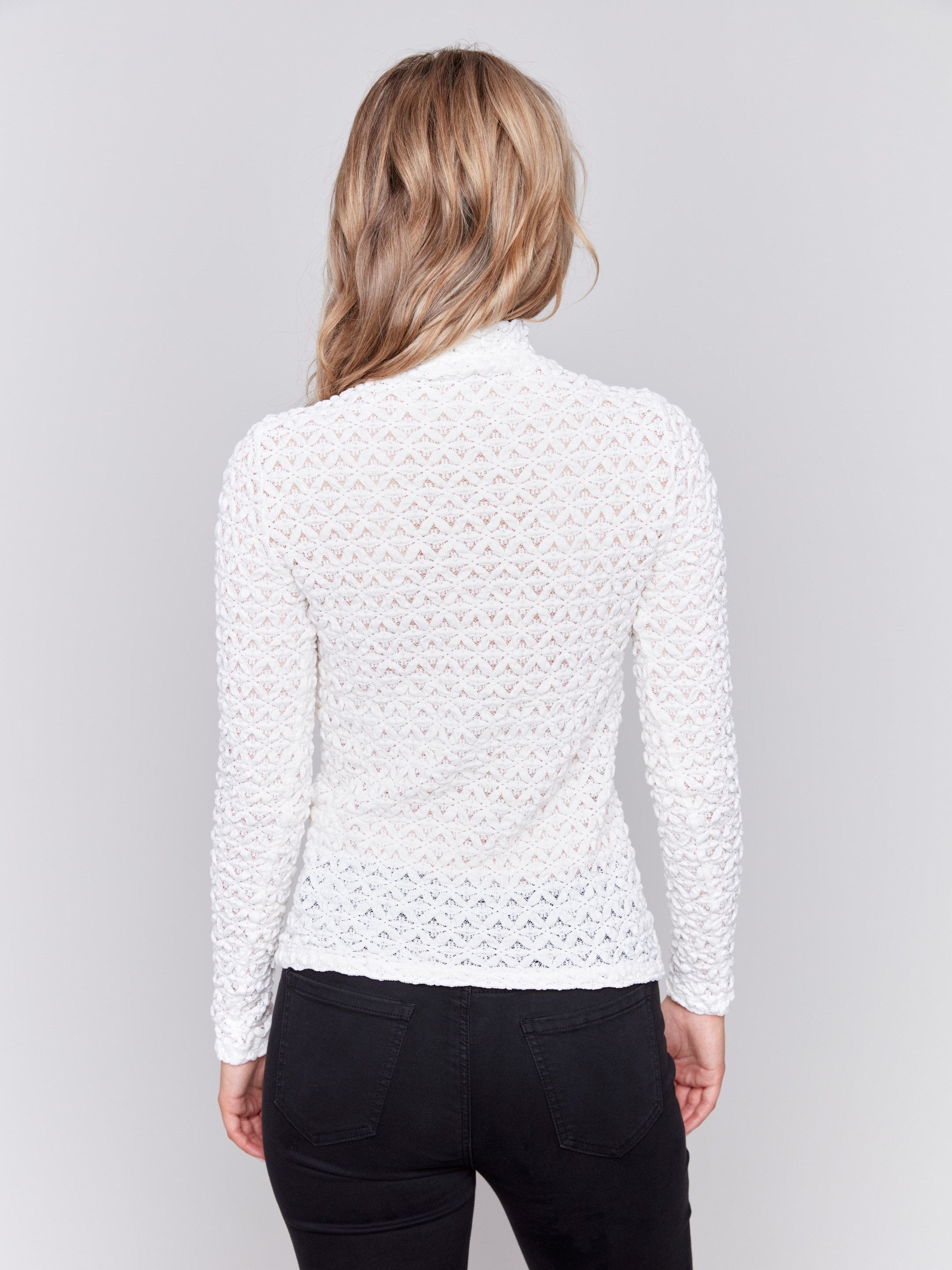 White lace mock neck long sleeve top by Charlie B. Detailed lace pattern with long sleeves and fitted silhouette.