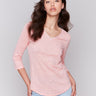 Guava V-neck top with 3/4 sleeves, made from a linen blend with neck trim detail, by Charlie B.