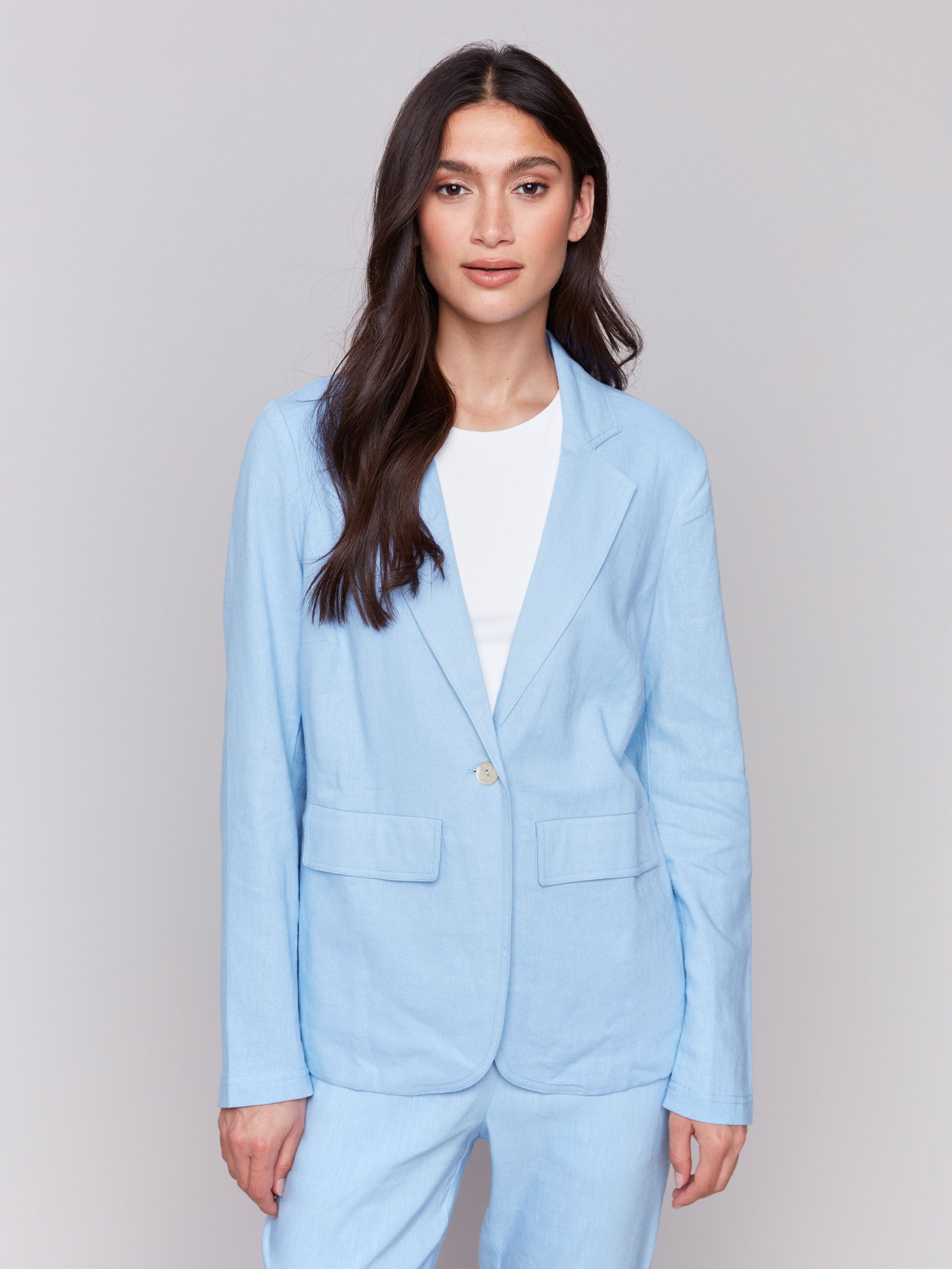 Light blue linen blend blazer with single-button closure, featuring a classic lapel and welt pockets by Charlie B.