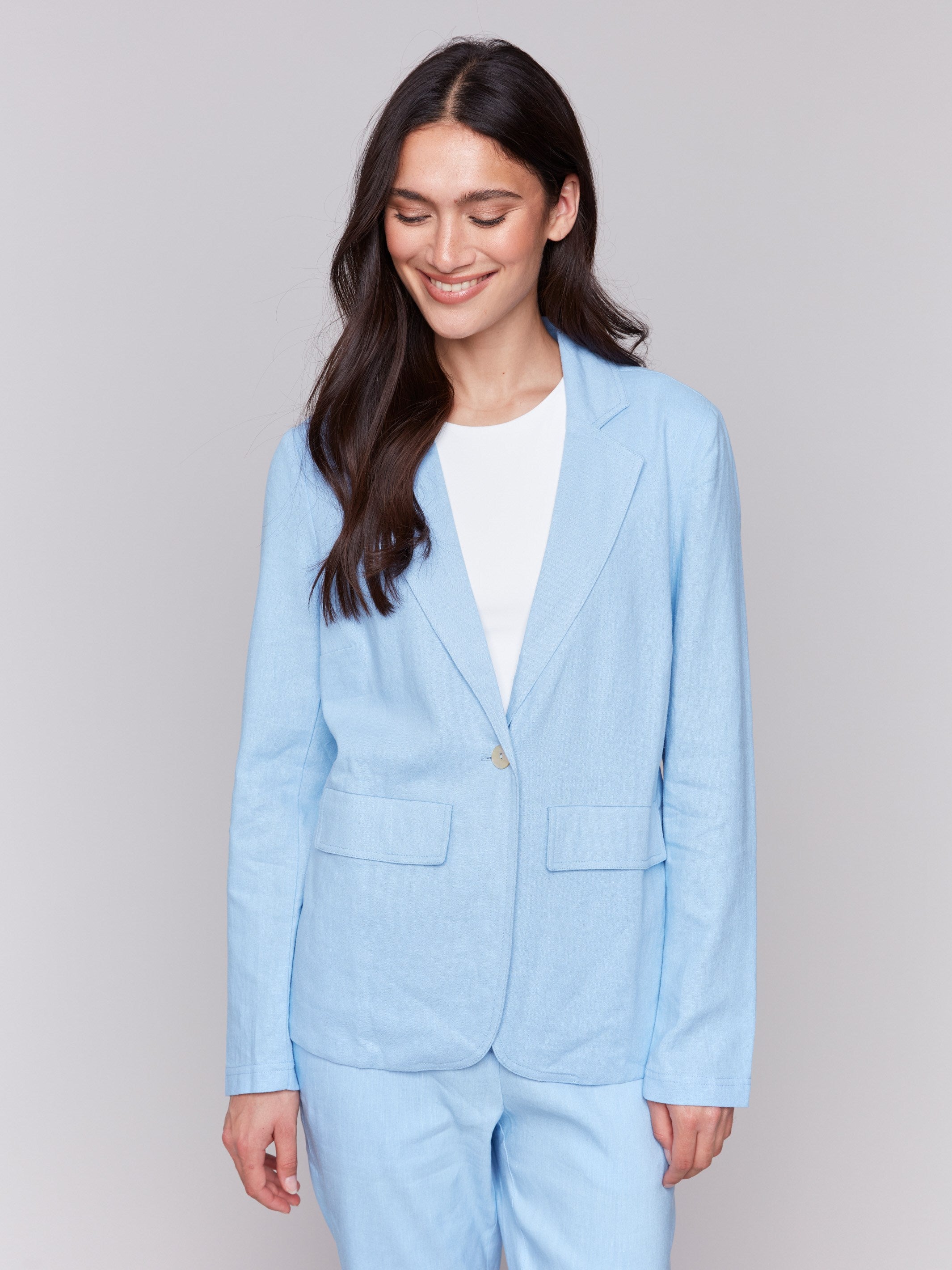 Light blue linen blend blazer with single-button closure, featuring a classic lapel and welt pockets by Charlie B.