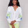 White linen blend blouse with V-neck and floral embroidery by Charlie B.