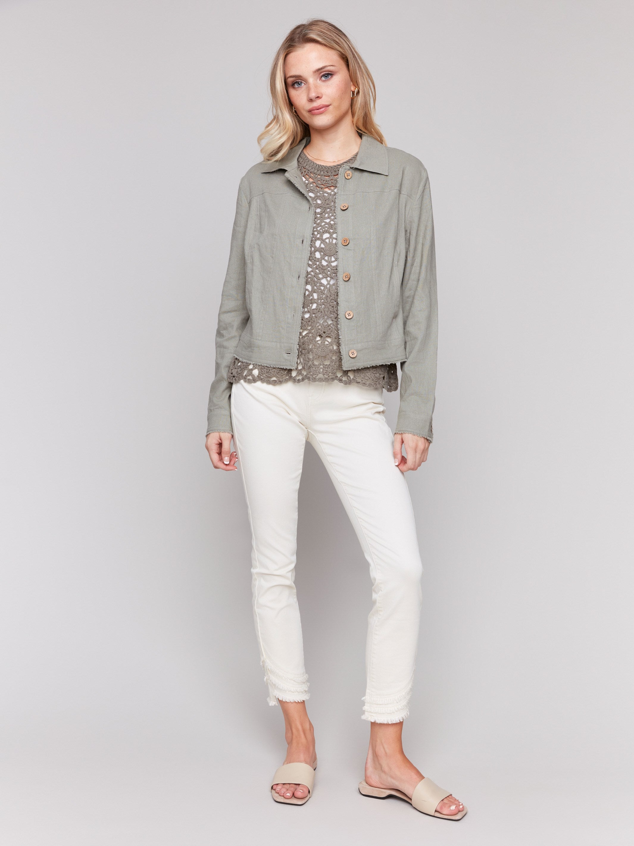 Celadon jacket featuring button closure and frayed edges by Charlie B.