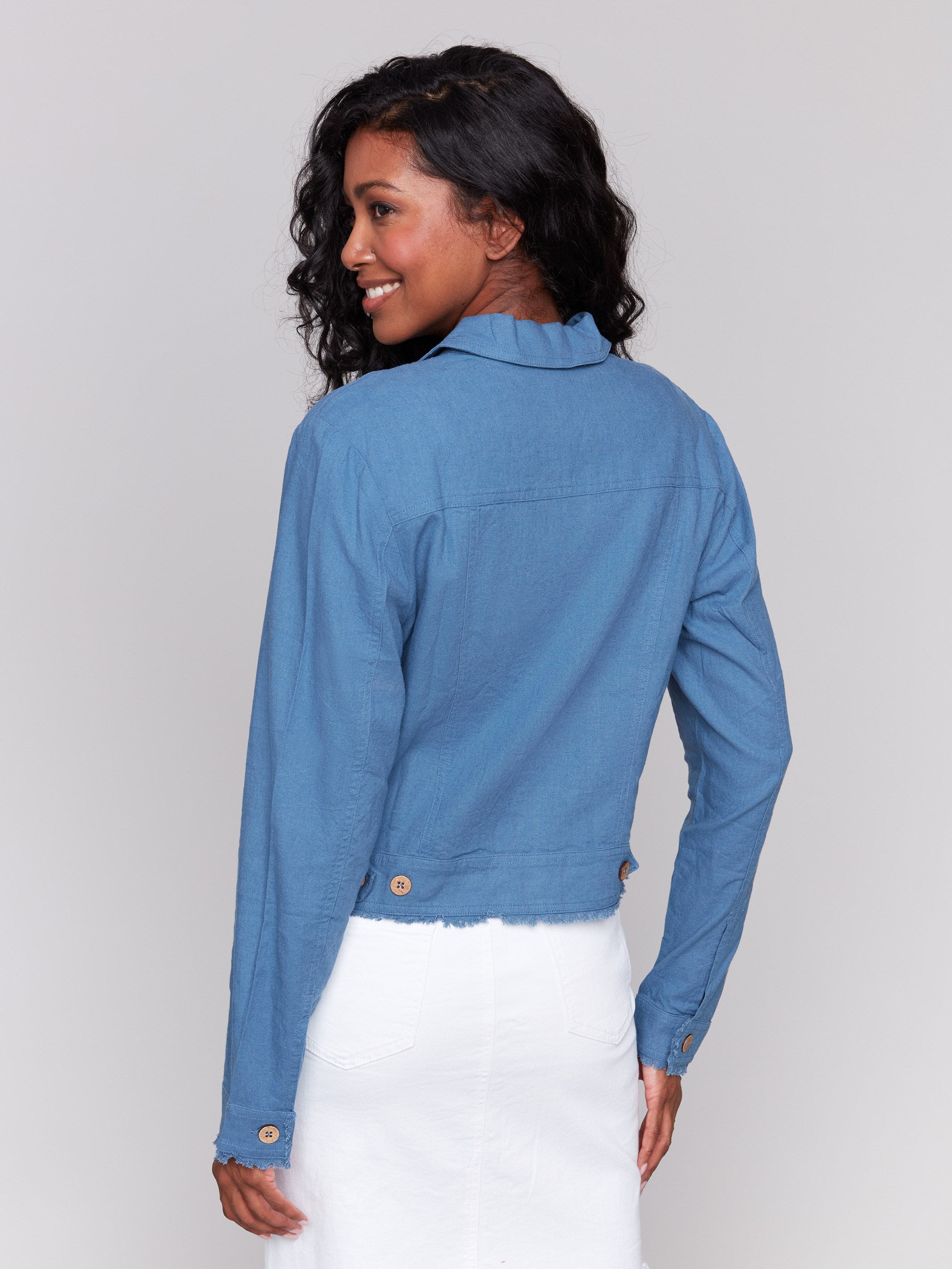 Fashionable blue jacket showcasing front pockets by Charlie B.