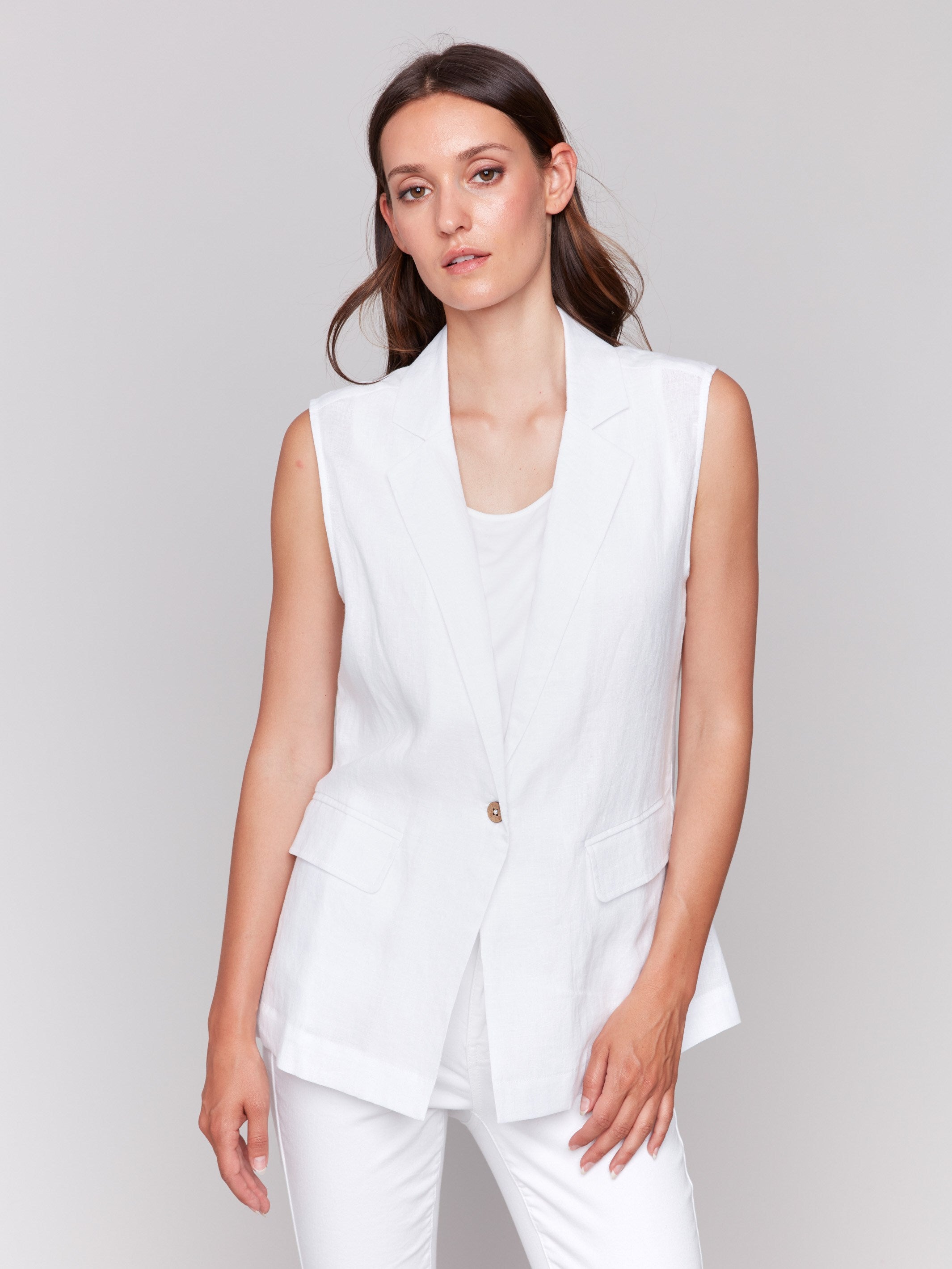 White linen blend vest by Charlie B. featuring a sleek lapel collar, paired with matching white pants.