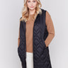 Black long quilted puffer vest with zip closure and hood by Charlie B.