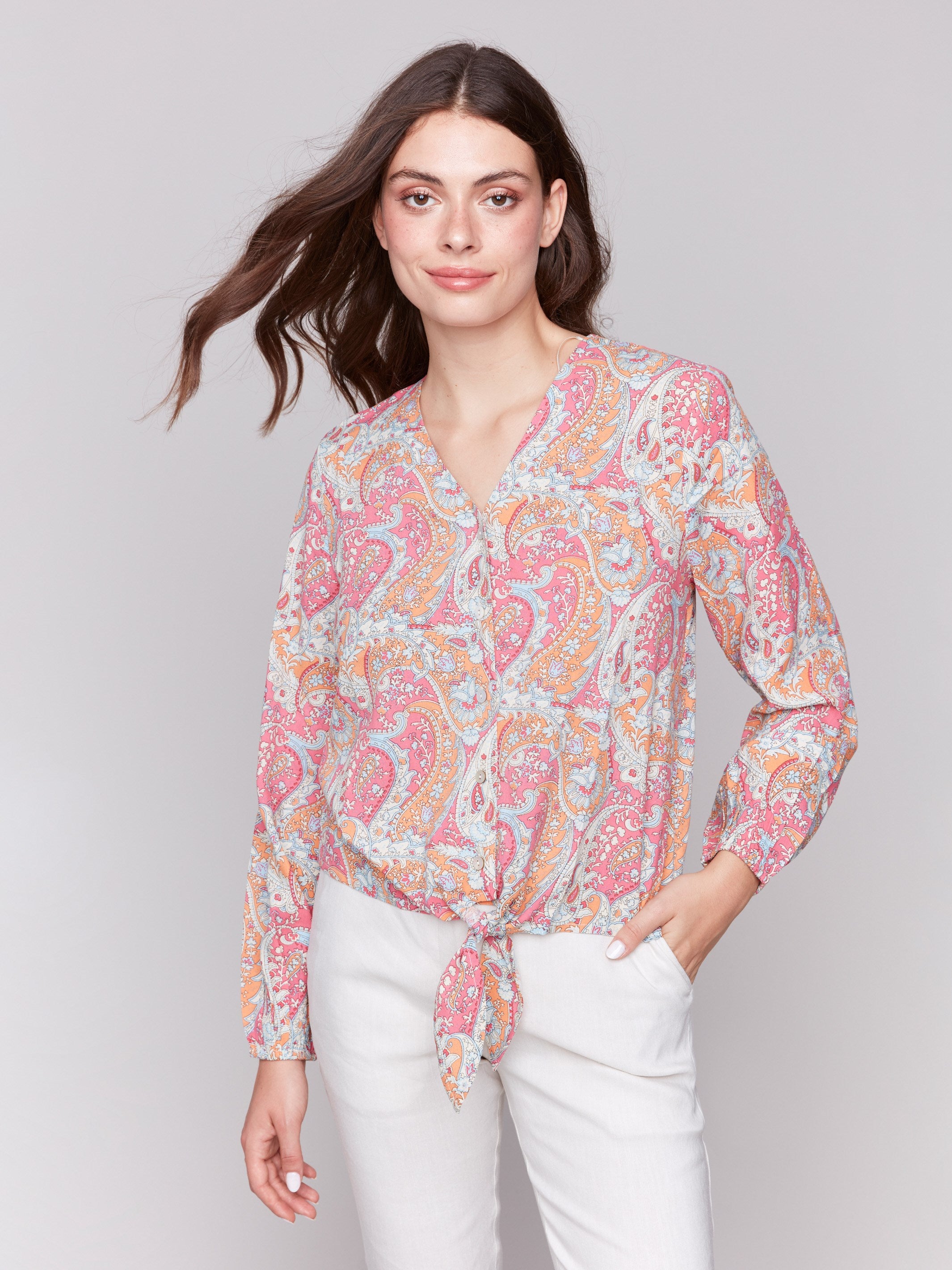 Long-sleeve blouse adorned in vibrant paisley pattern with a chic V-neck by Charlie B.