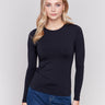 Black long-sleeve top with crew neckline, featuring a fitted silhouette by Charlie B.