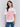 White t-shirt with a crew neckline and pink graphic by Charlie B.