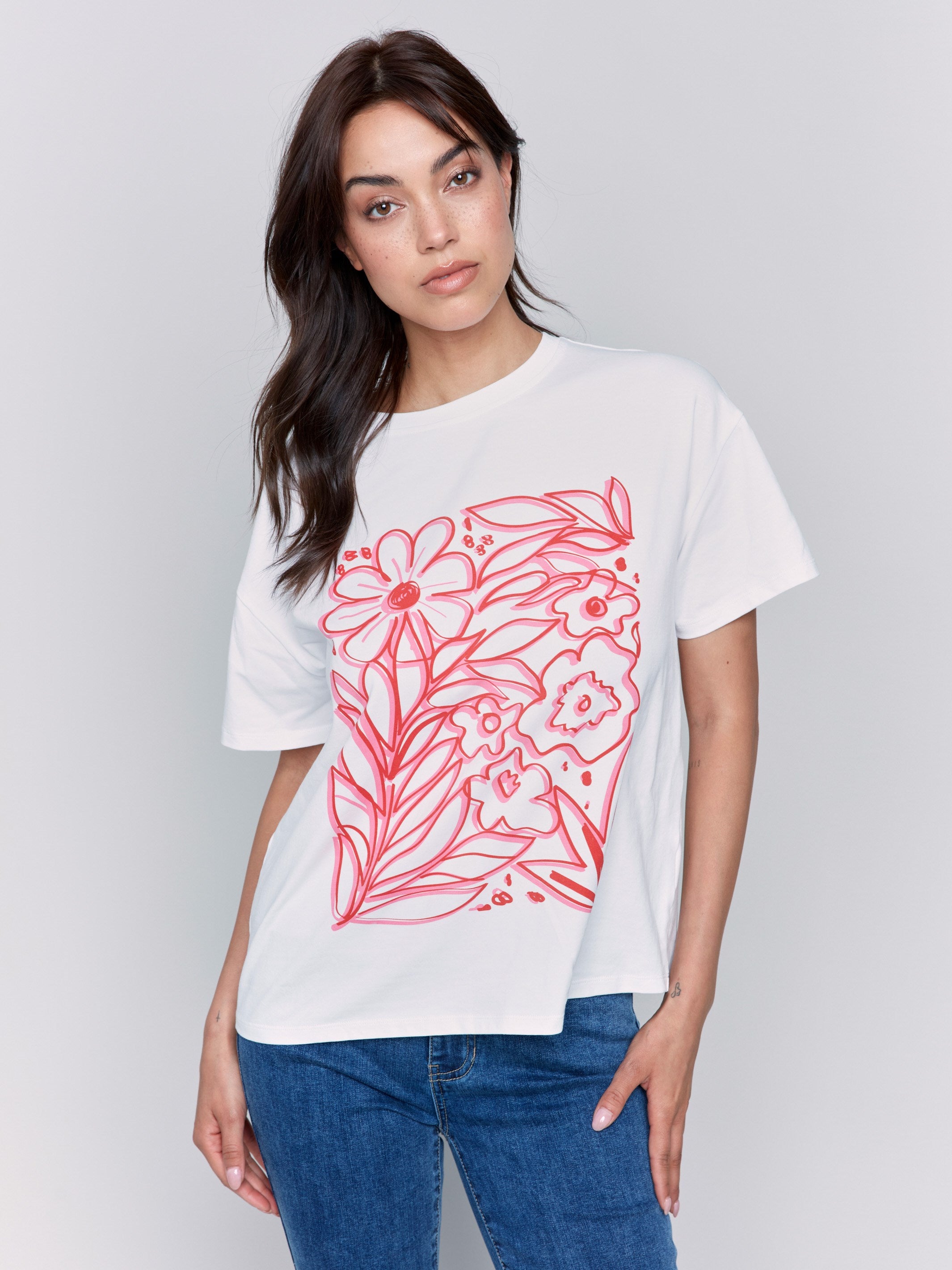 White t-shirt with drop shoulder design and floral print by Charlie B.