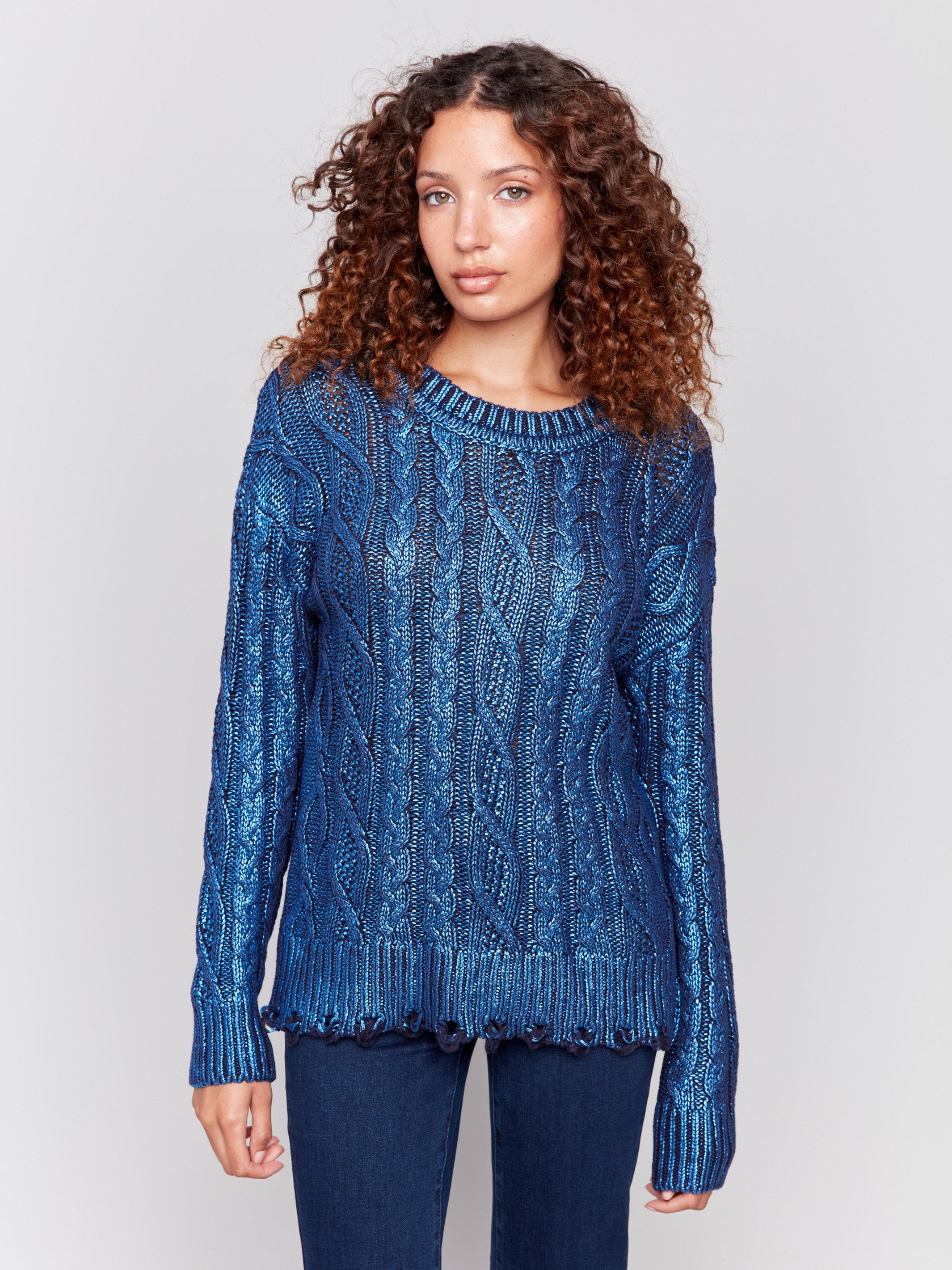 Blue metallic cable knit sweater with long sleeves and a crew neckline by Charlie B.