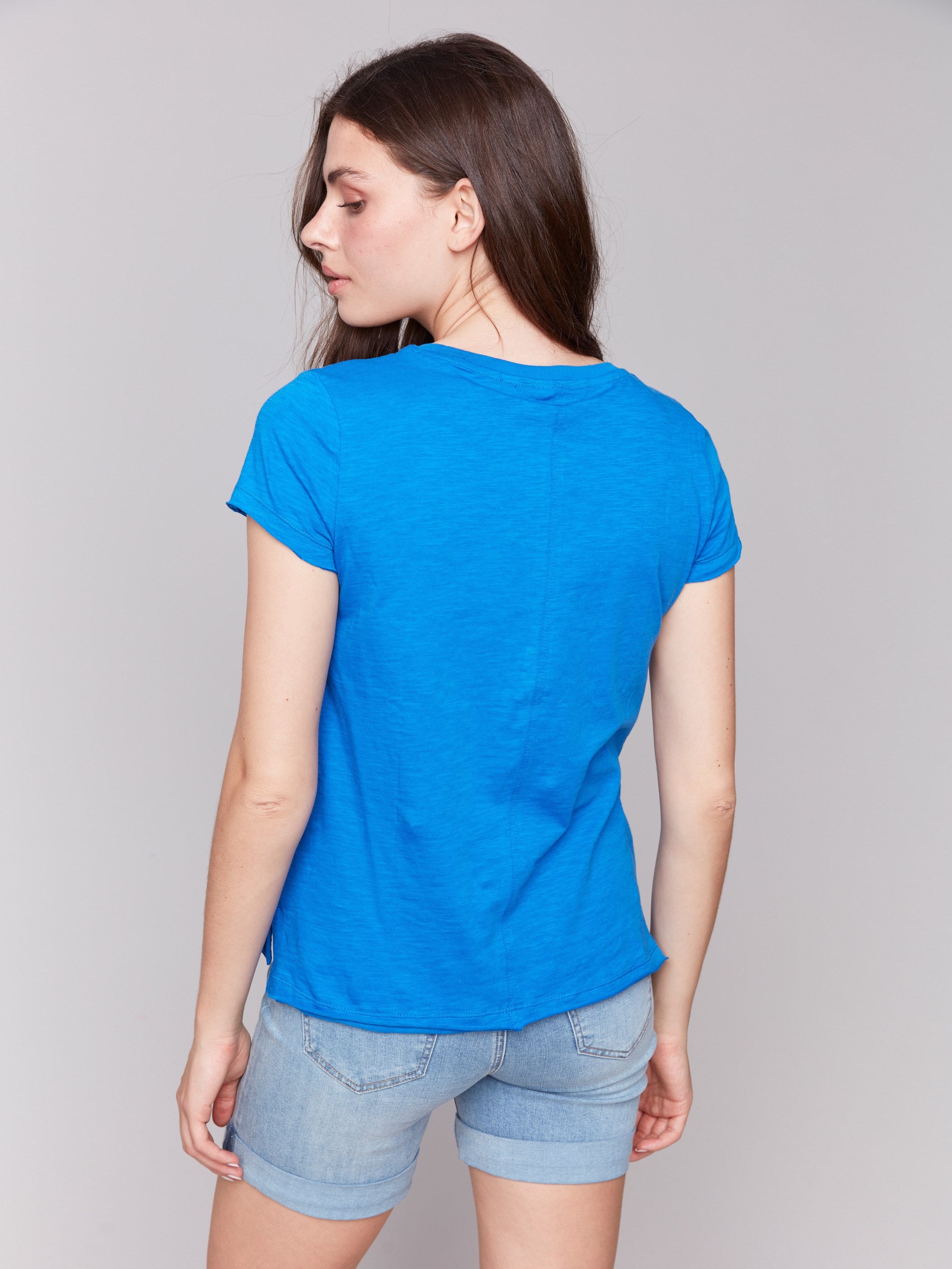 Coastal blue short-sleeve organic cotton t-shirt with a front seam detail and side slits, by Charlie B.