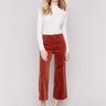 Terracotta orange corduroy flare pants with front and back patch pockets, a regular rise, and cropped design by Charlie B.