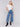 Medium blue jeans with front patch pockets and a flared leg, featuring a mid-rise by Charlie B.