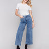 Medium blue jeans with front patch pockets and a flared leg, featuring a mid-rise by Charlie B.