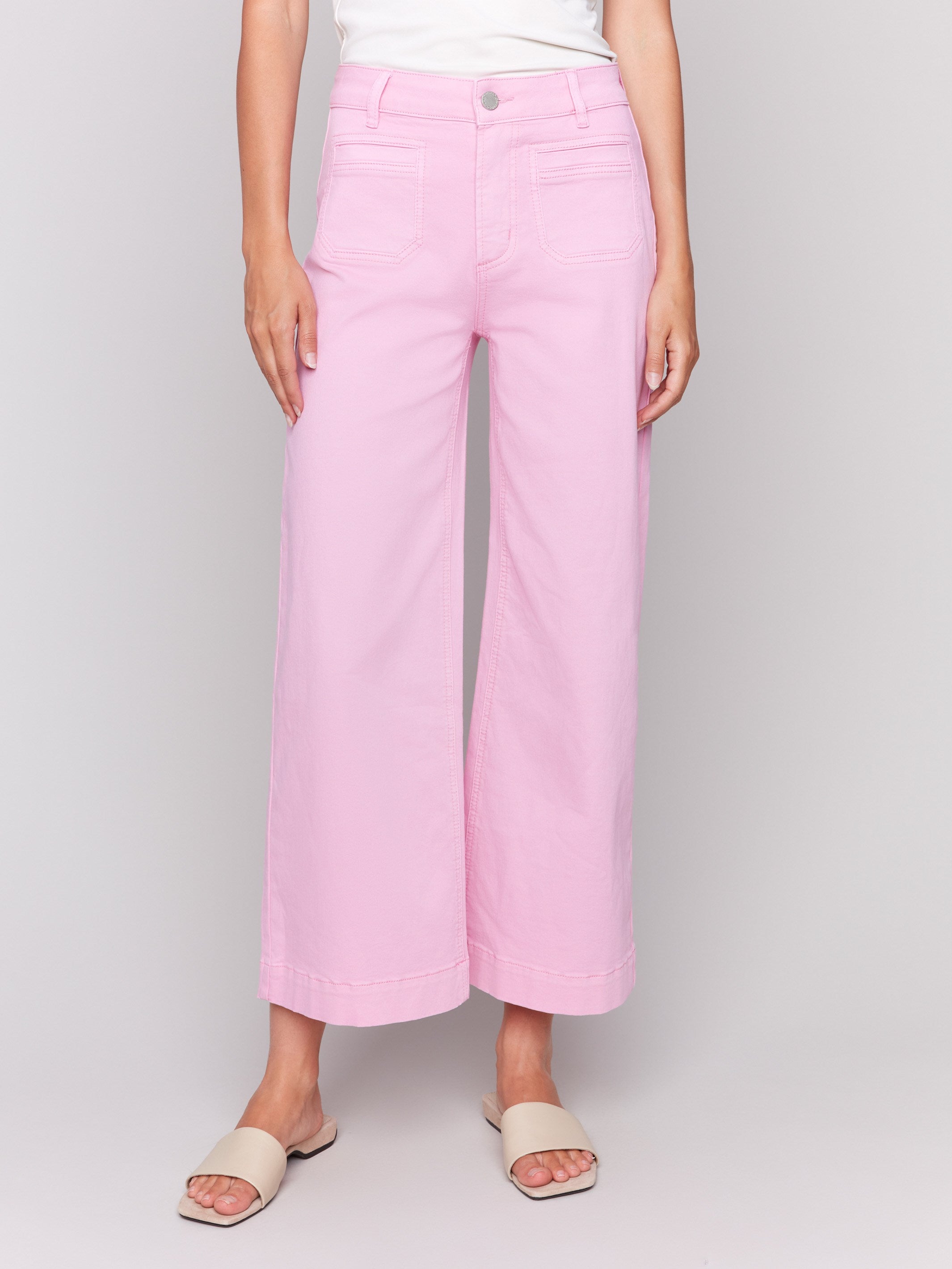 Begonia flare twill pants featuring front patch pockets with a regular rise, button closure by Charlie B.