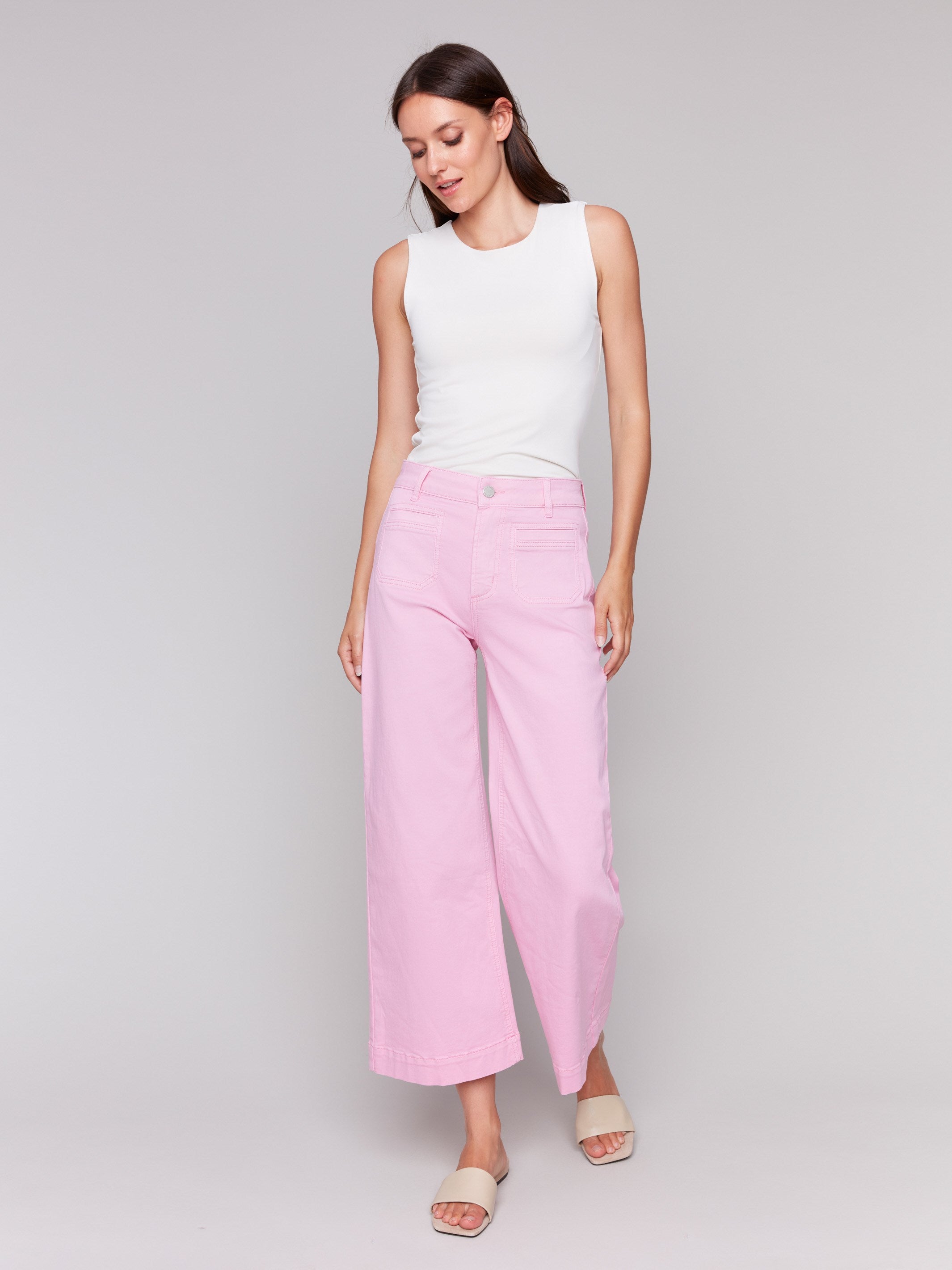 Begonia flare twill pants featuring front patch pockets with a regular rise, button closure by Charlie B.