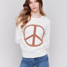 Ecru white sweater featuring a large peace sign graphic on the front with blanket stitch detailing, long sleeves, and crew neckline by Charlie B.