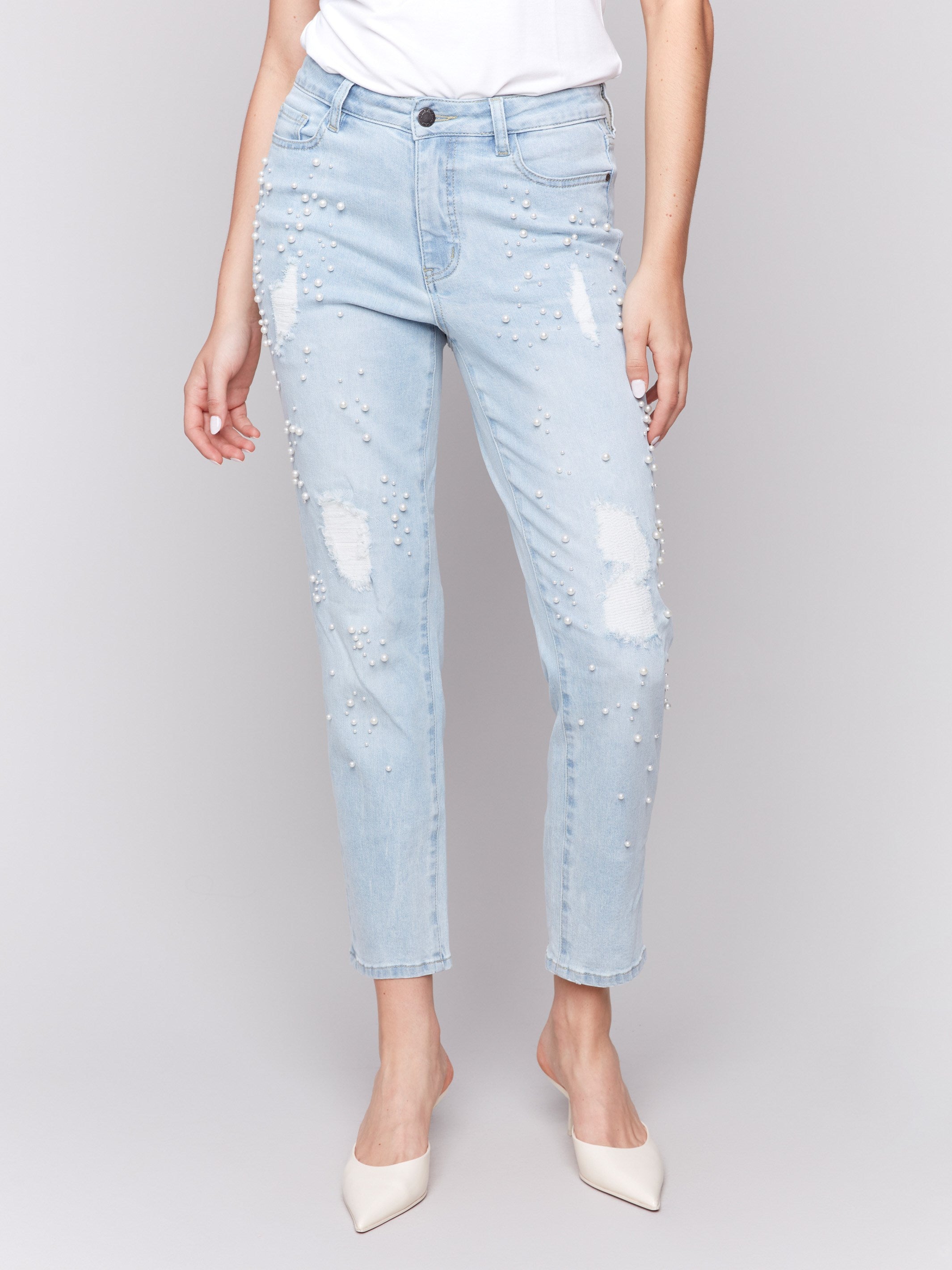 Ankle-length slim-fit jeans featuring elegant distressed details by Charlie B.