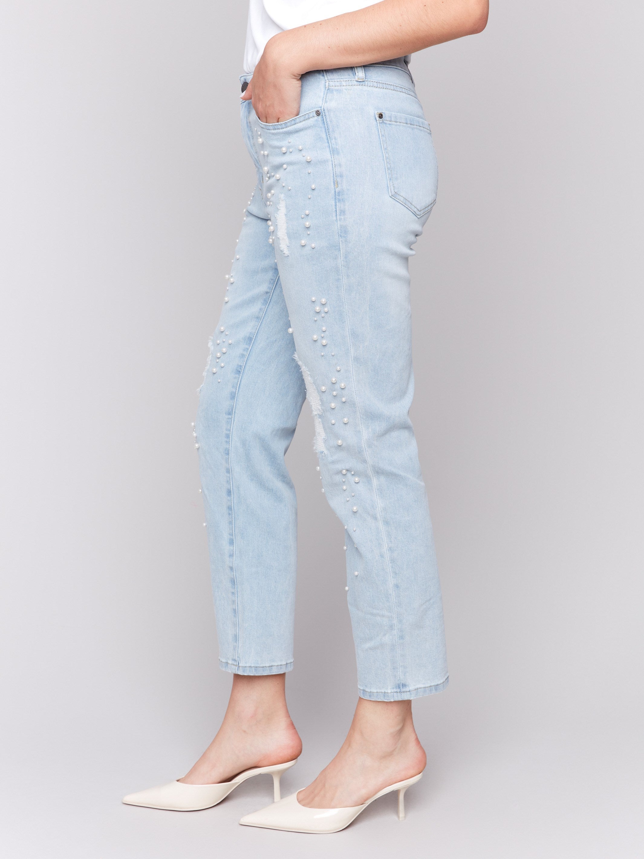 Five-pocket design jeans with unique pearl accents for style by Charlie B.