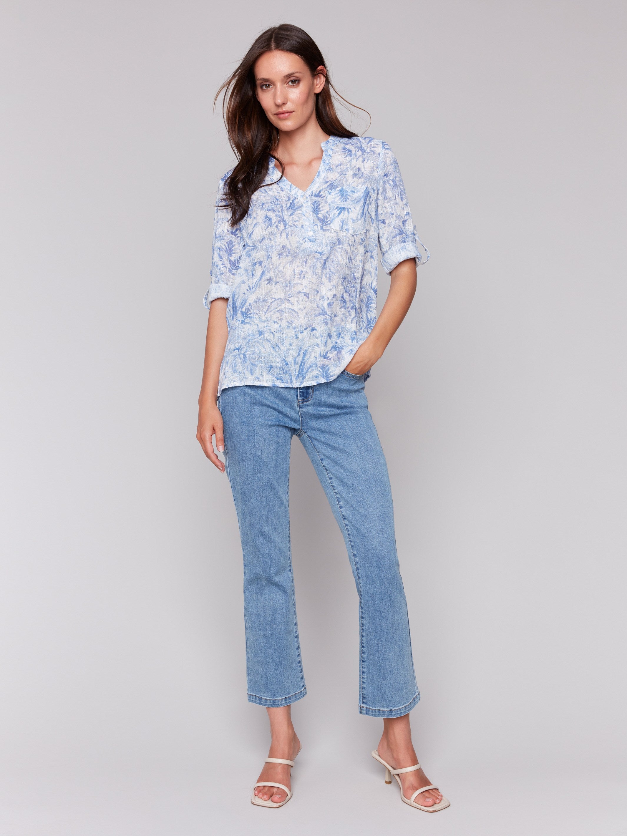 Blouse featuring adjustable 3/4 roll-up sleeves with a half-button front by Charlie B.