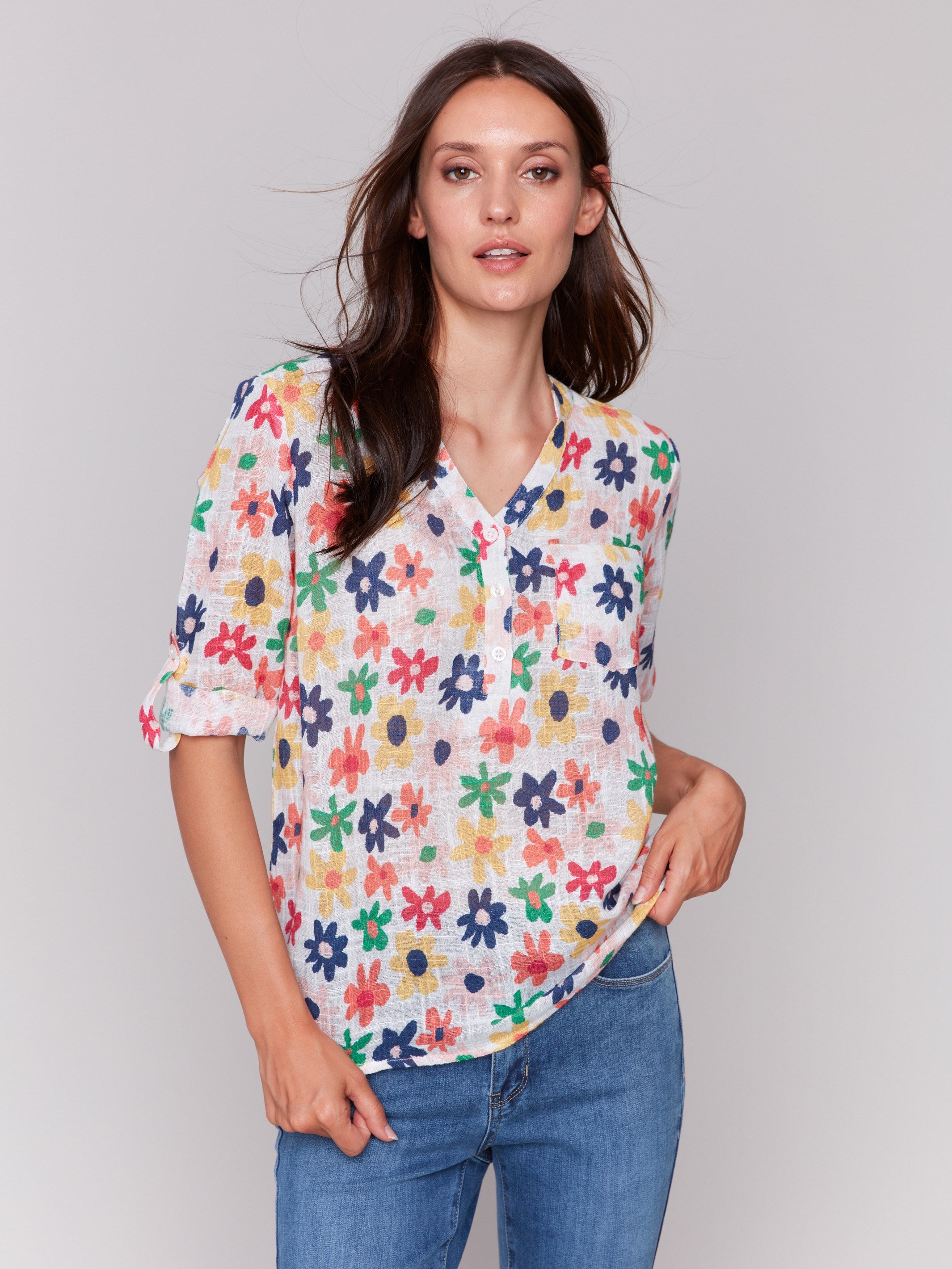 Half-button front blouse with a colorful daisy design by Charlie B.