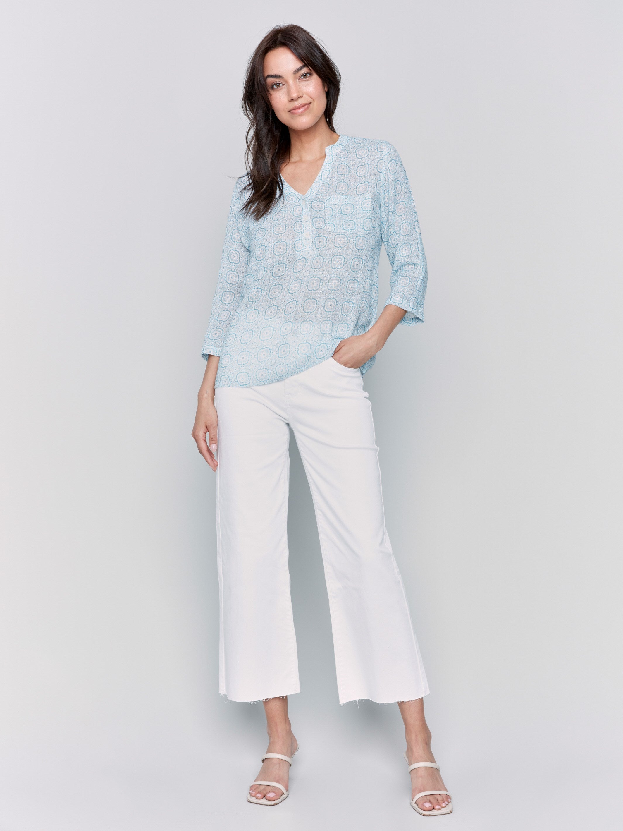 Blue blouse featuring adjustable 3/4 roll-up sleeves by Charlie B.