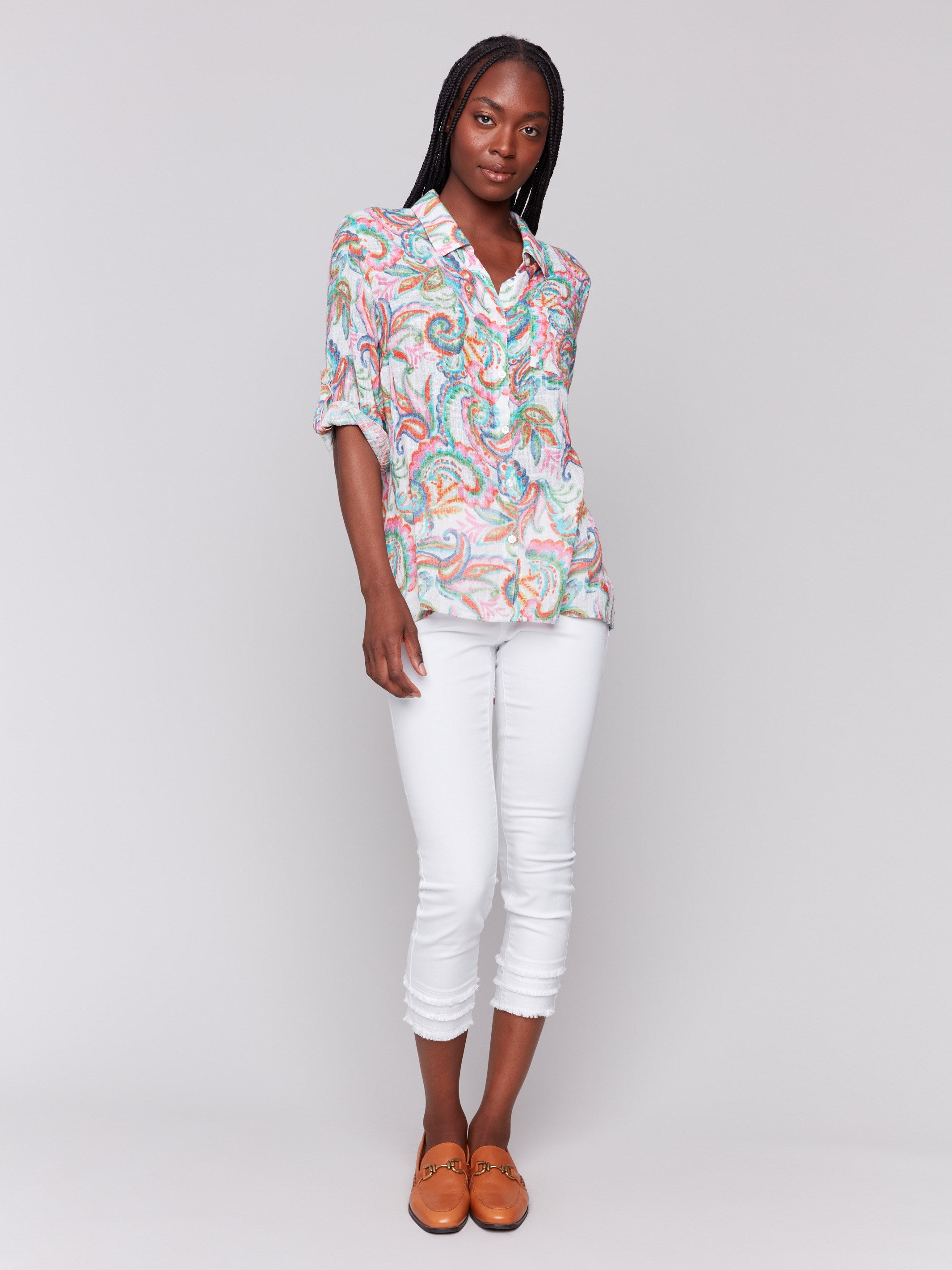 Vibrant shirt featuring 3/4 roll-up sleeves with button tab by Charlie B.