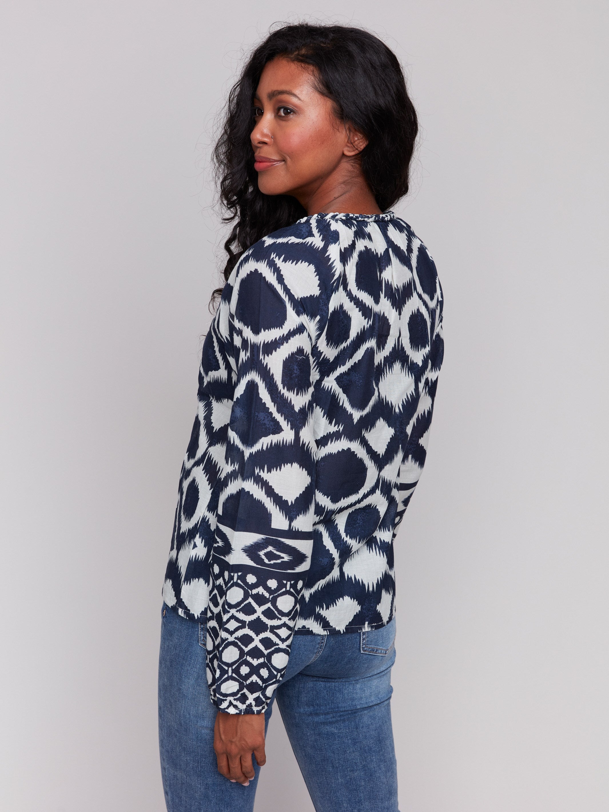 Geometric pattern navy blouse with raglan sleeves by Charlie B.