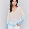 Soft pastel sweater featuring a unique tie-dye design by Charlie B.