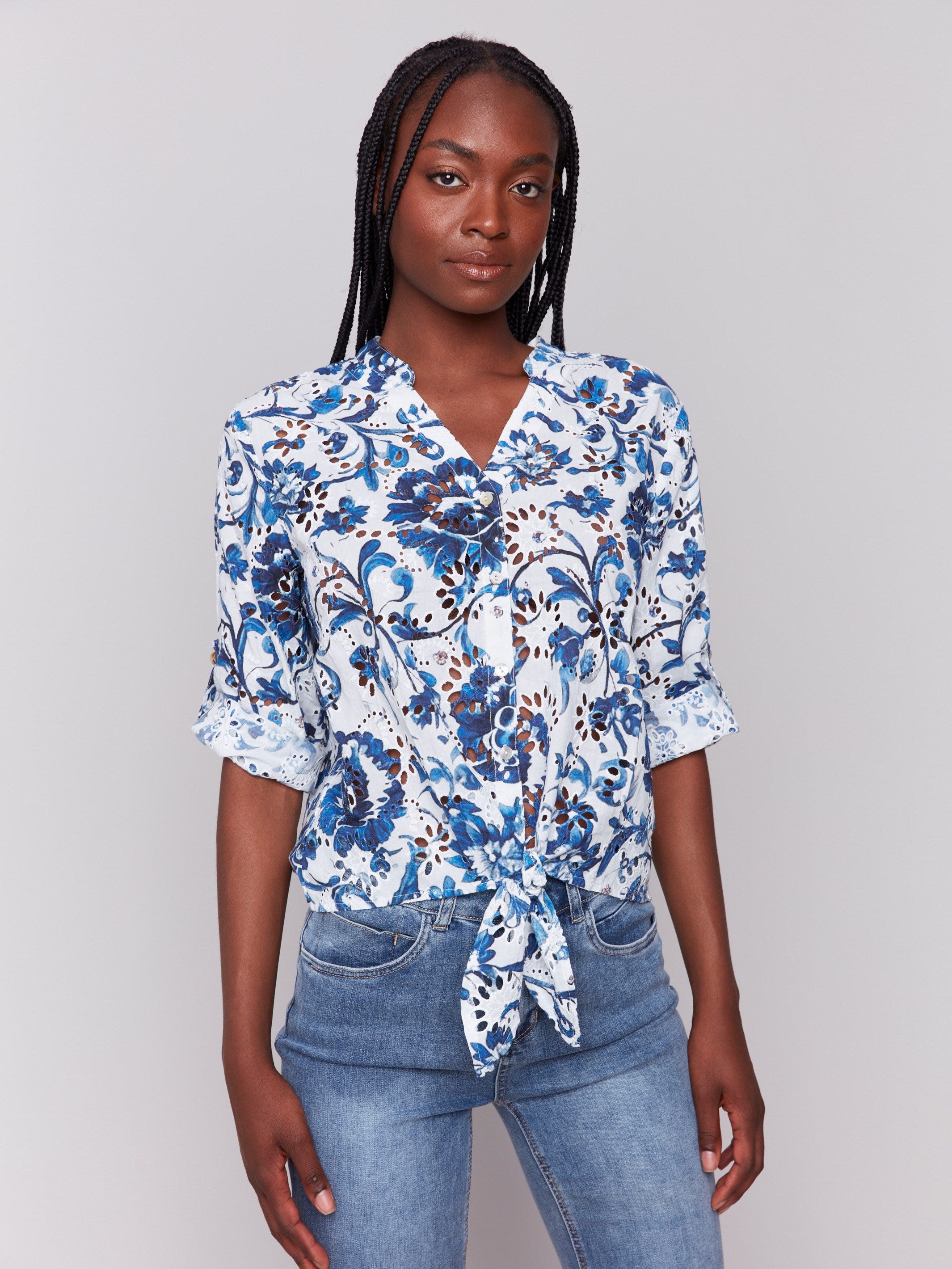 V-neckline blue floral blouse with eyelet fabric by Charlie B.