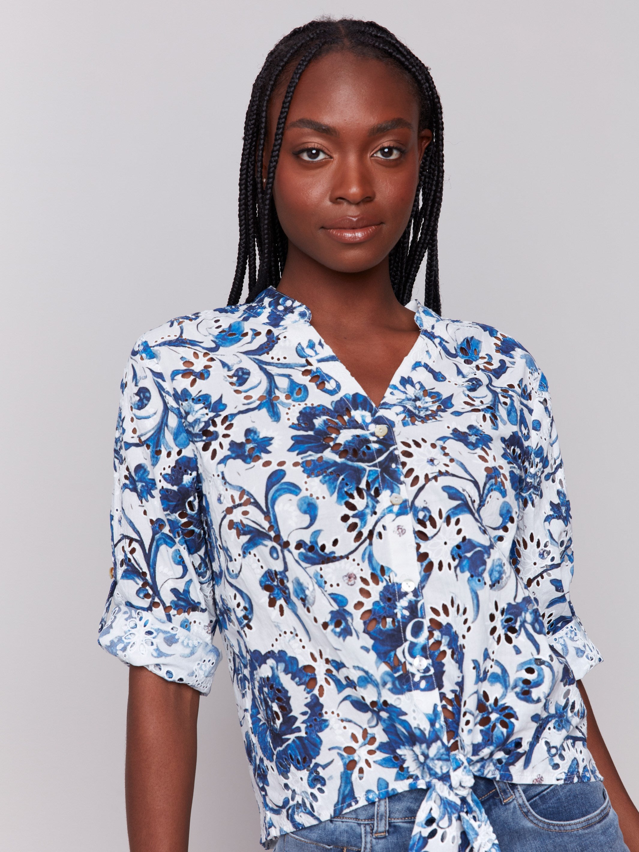 Button-down front blue blouse with floral pattern by Charlie B.