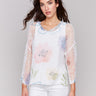 A lightweight V-neck crochet sweater with a watercolor print and loose fit by Charlie B.