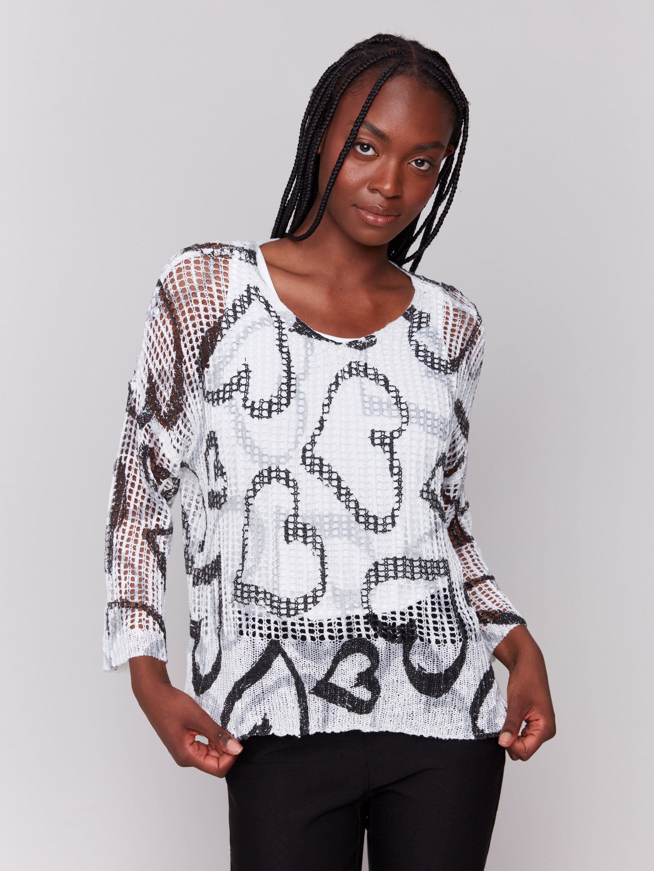 A lightweight V-neck crochet sweater with a hearts pattern and loose fit by Charlie B.