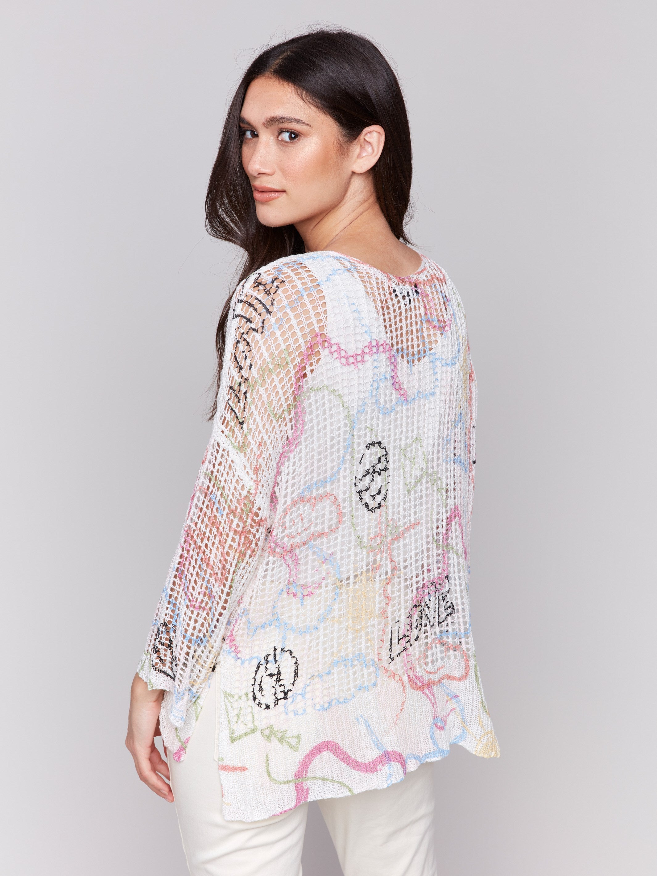 A lightweight V-neck crochet sweater with a graffiti print and loose fit by Charlie B.