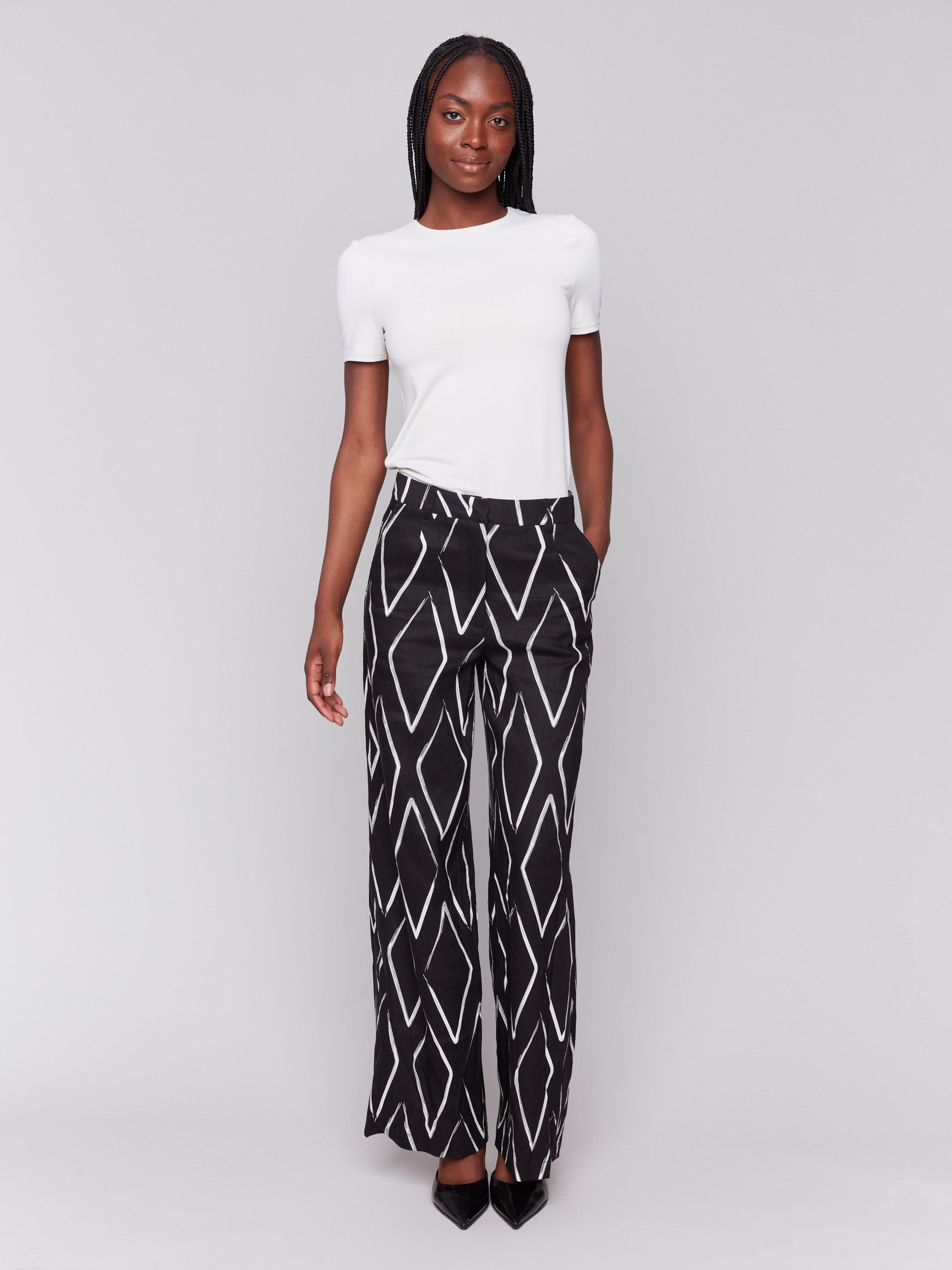 Black and white pants with a geometric pattern and wide-leg design by Charlie B.