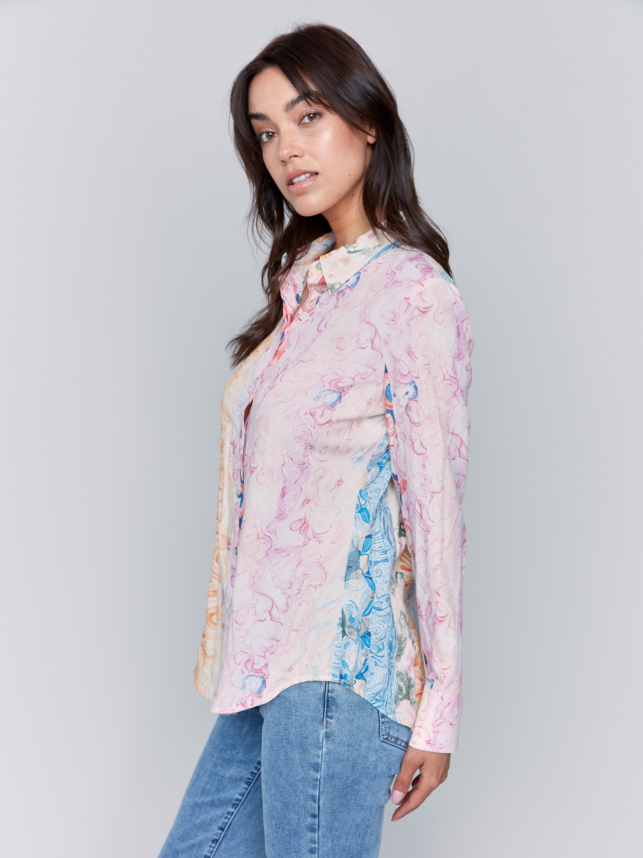 Abstract patterned blouse showcasing elegant long sleeves by Charlie B.