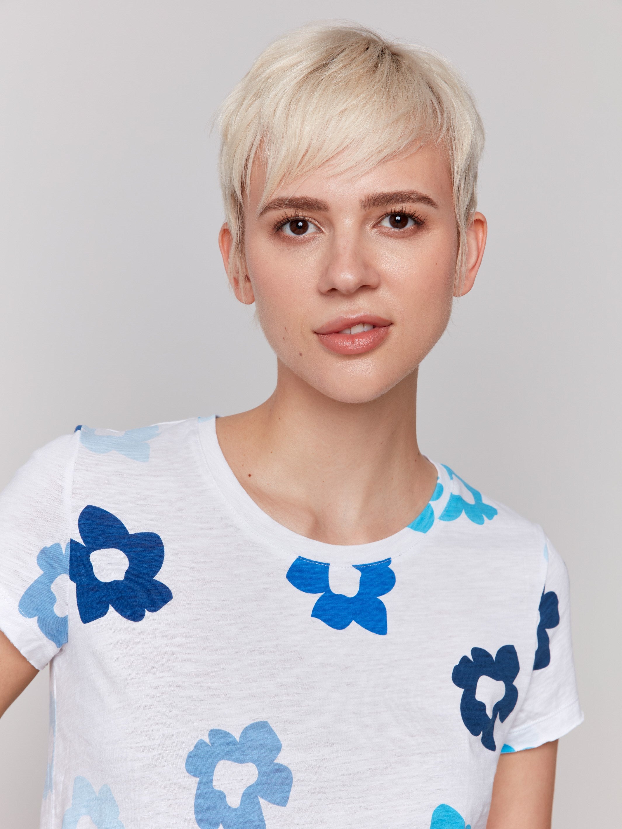 Organic cotton t-shirt featuring a vibrant floral design by Charlie B.