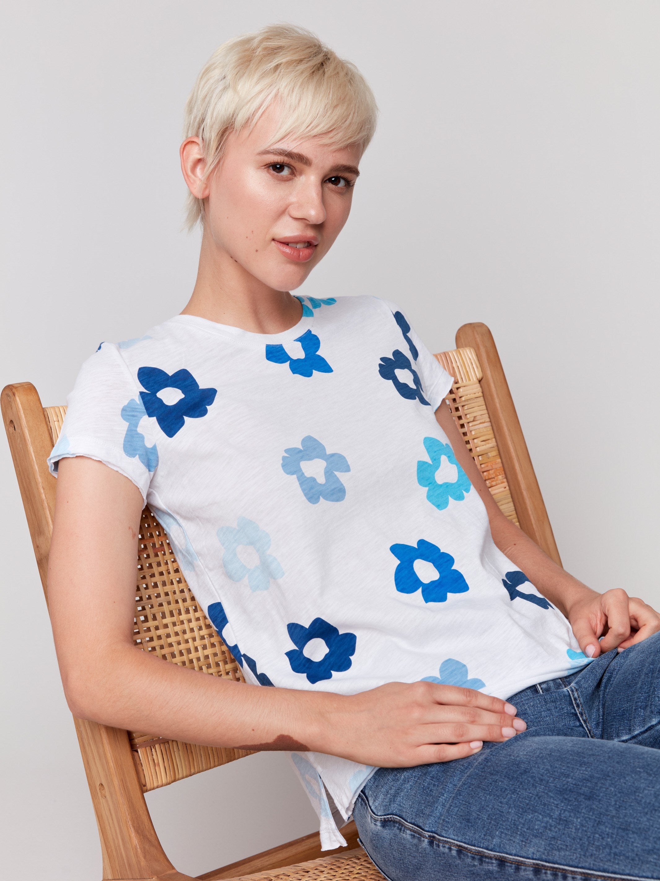 Crew neck tee in white with elegant blue flowers by Charlie B.