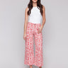 Printed patch pocket flare pants in a red and white abstract design for women, Charlie B.