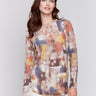 Abstract multicolor sweater with cranberry hues, featuring long sleeves and crew neckline by Charlie B.