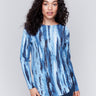 Denim-colored plush knit sweater with an abstract vertical striped pattern, round neckline, rounded hem, and side pockets by Charlie B.