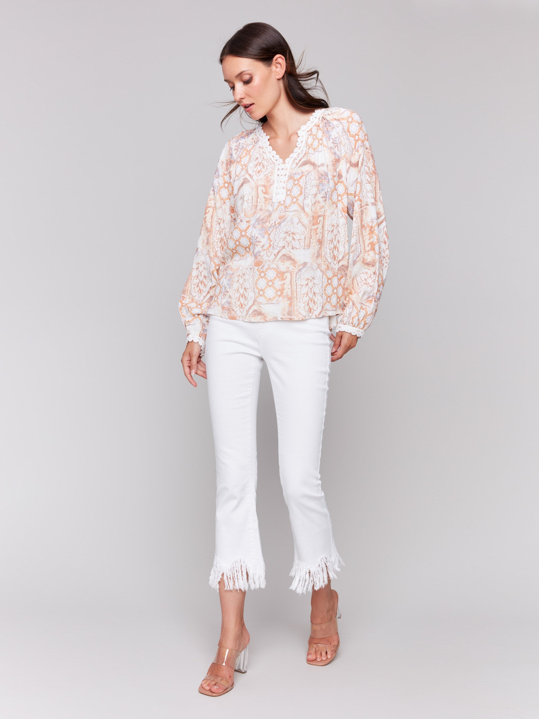 Blouse with raglan long sleeves and geometric floral prints by Charlie B.