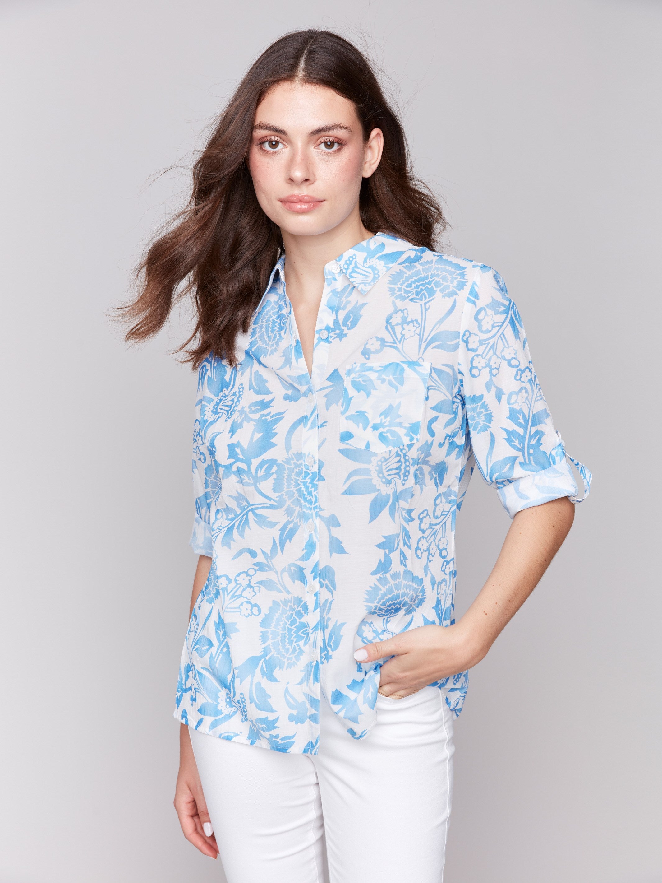 Shirt with a classic collar and blue floral pattern by Charlie B.