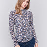 Long sleeve mock neck top with a safari print by Charlie B.