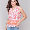 Clementine and pink blouse with intricate abstract pattern by Charlie B.