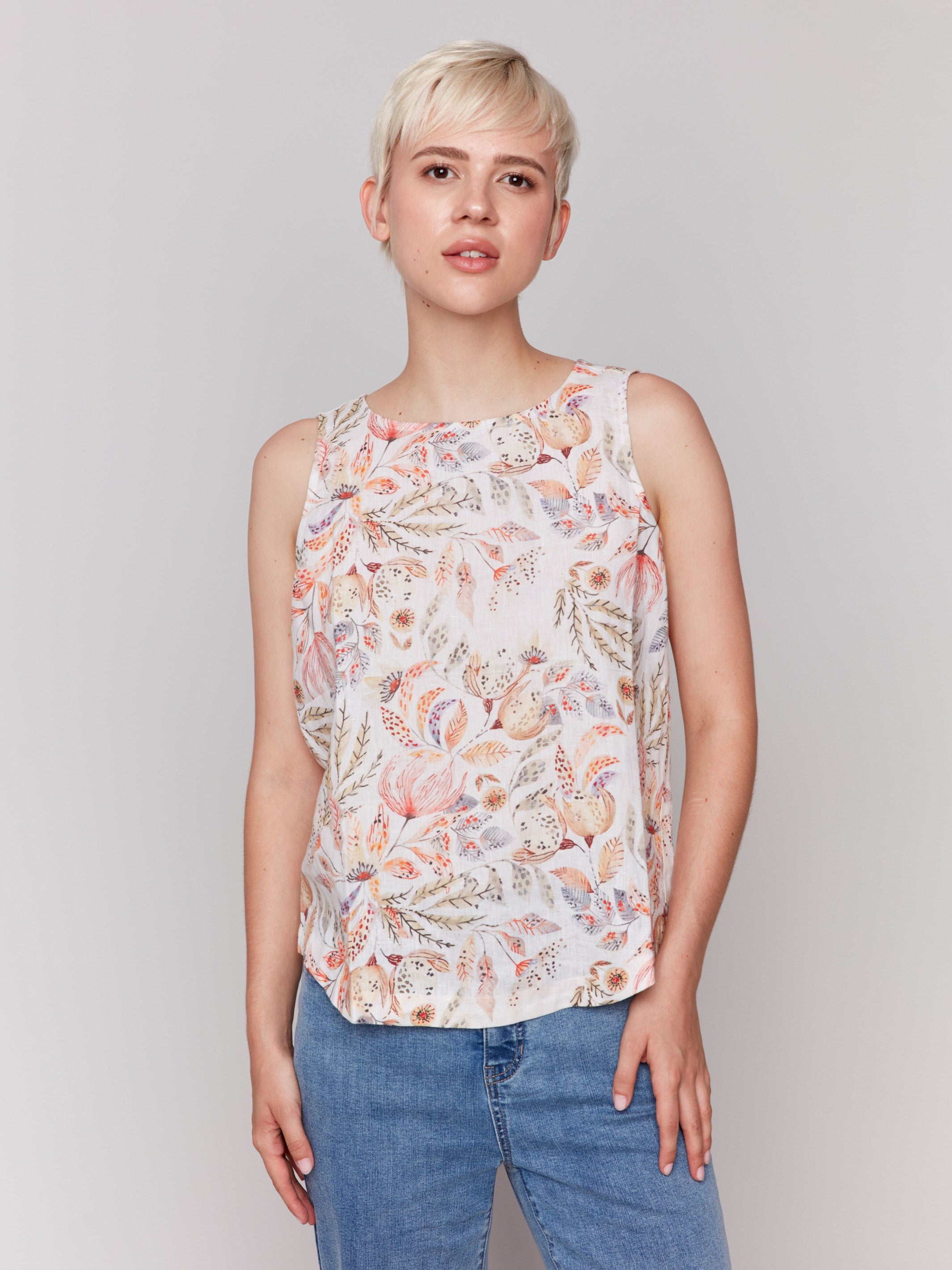 Top with crew neckline and vibrant floral design by Charlie B.