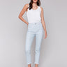 Light blue twill pants with subtle stripe pattern, featuring a slim leg silhouette and a slit at the hem by Charlie B.