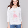 White V-neck knit top with watercolor tie-dye effect and drop shoulders by Charlie B.