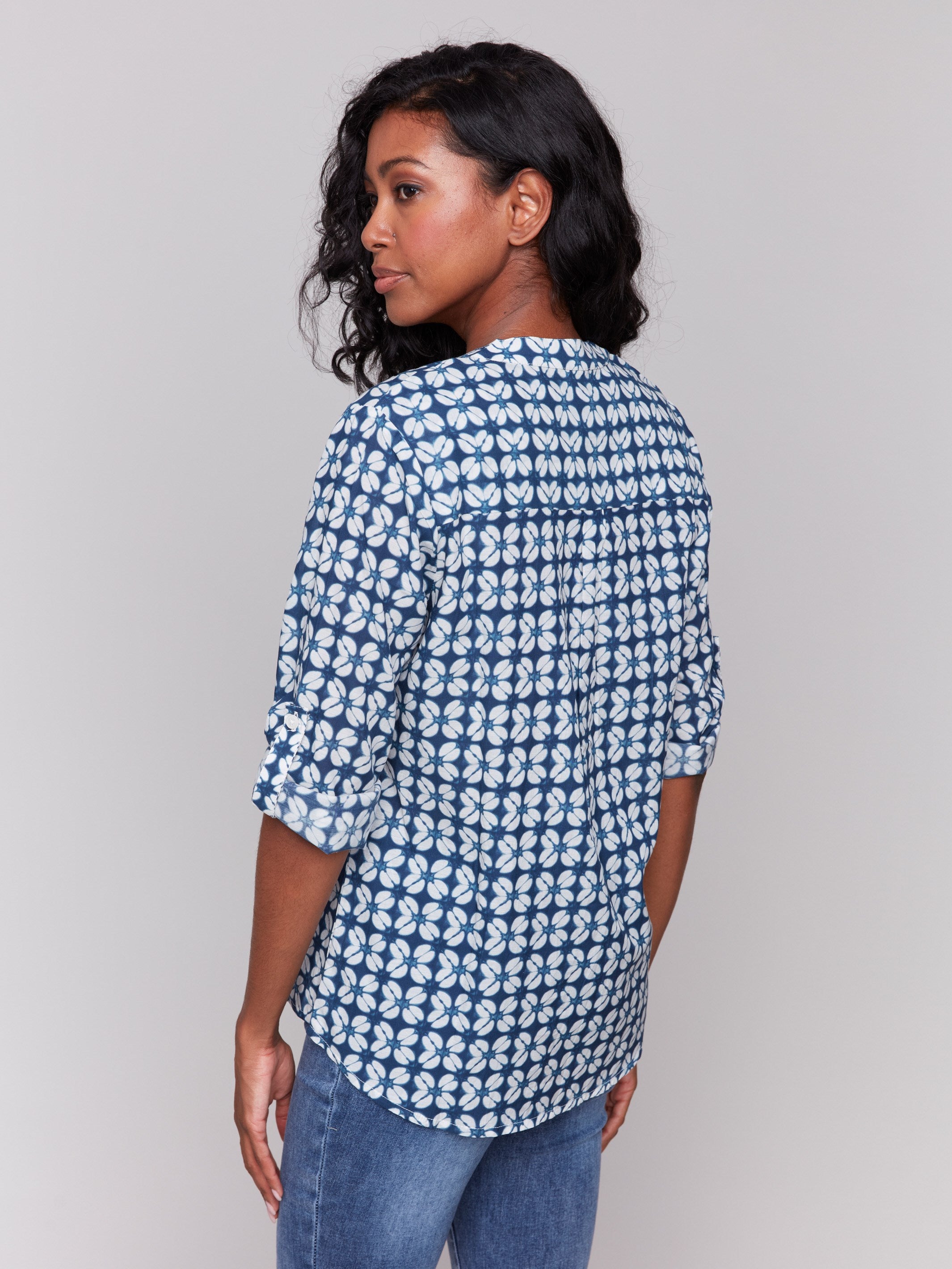 Elegant blouse in blue with a unique geometric pattern and comfortable relaxed fit by Charlie B.