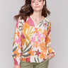 V-neck blouse with vibrant floral pattern by Charlie B.